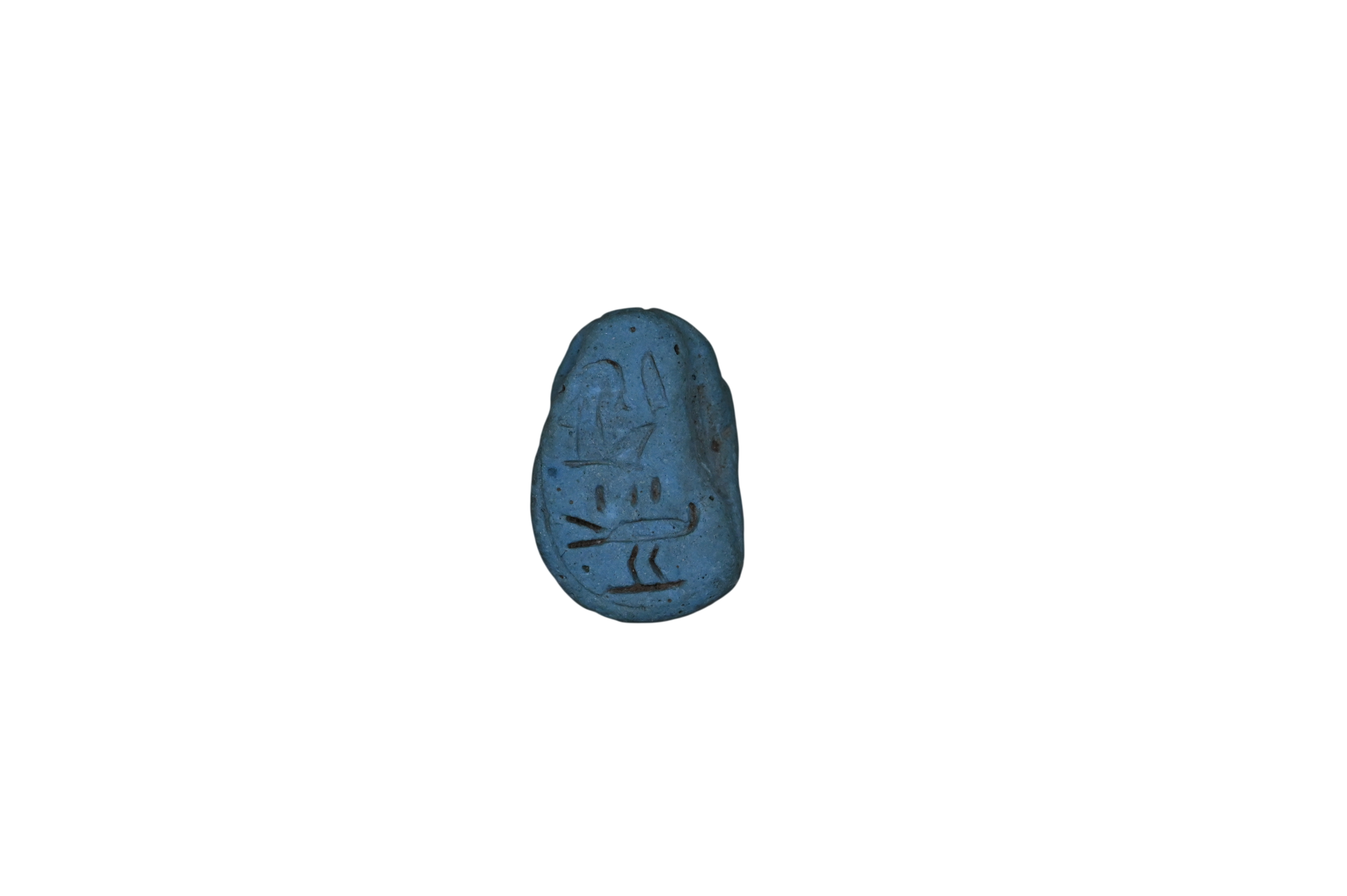 Ancient Egyptian blue scarab from the New Kingdom with hieroglyphic inscription